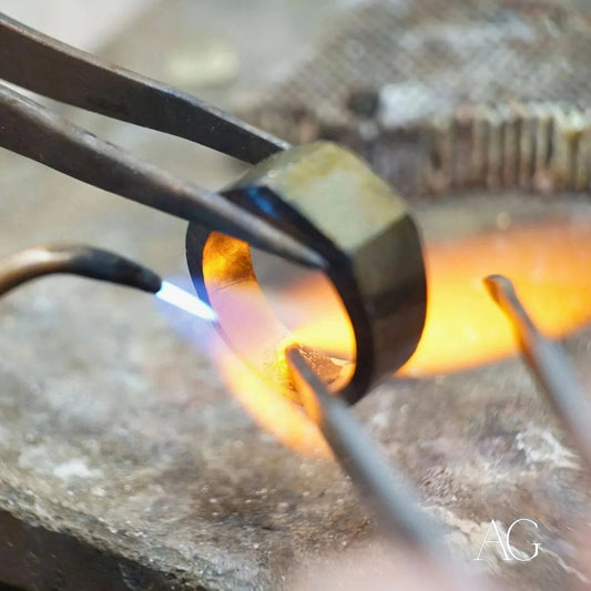Metal ring heating with flame for Art Gold jewelry repair in gold jewelry restoration