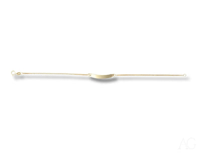 Long, thin medical catheter with a curved tip next to Solid 18k Gold kids bracelet