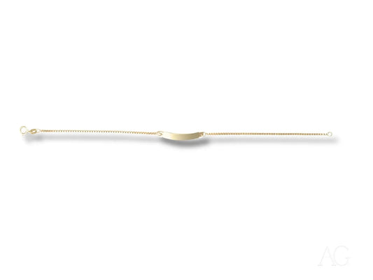 Long, thin medical catheter with a curved tip next to Solid 18k Gold kids bracelet