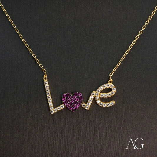 Gold necklace spelling Love with purple heart gemstone in 18k gold jewelry