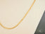 Supreme Elegance 18K Gold Cuban Chain Necklace showcasing art gold jewelry