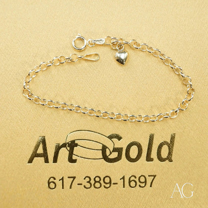 Delicate silver chain bracelet with small heart charm from Timeless 18k Gold Heart collection
