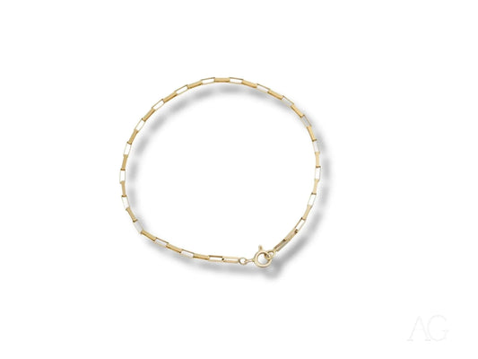 Delicate gold and white beaded bracelet showcasing a solid 18k gold brick link design