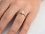 Gold engagement ring featuring a round diamond solitaire in 18k gold as the focal point