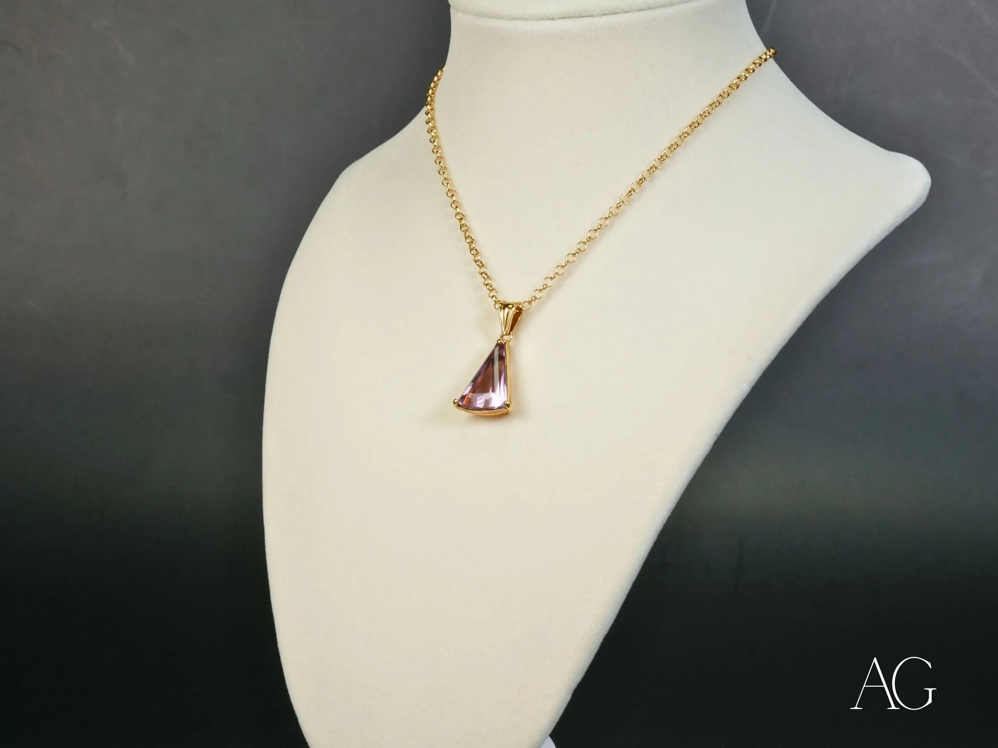 Gold-toned 18k gold necklace featuring a pink triangular crystal Amethyst Trillion Pendant