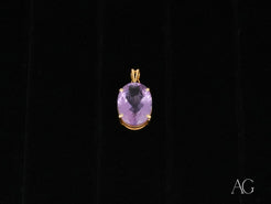 Oval-shaped Amethyst Glow Pendant in 18k gold featuring a stunning amethyst crystal