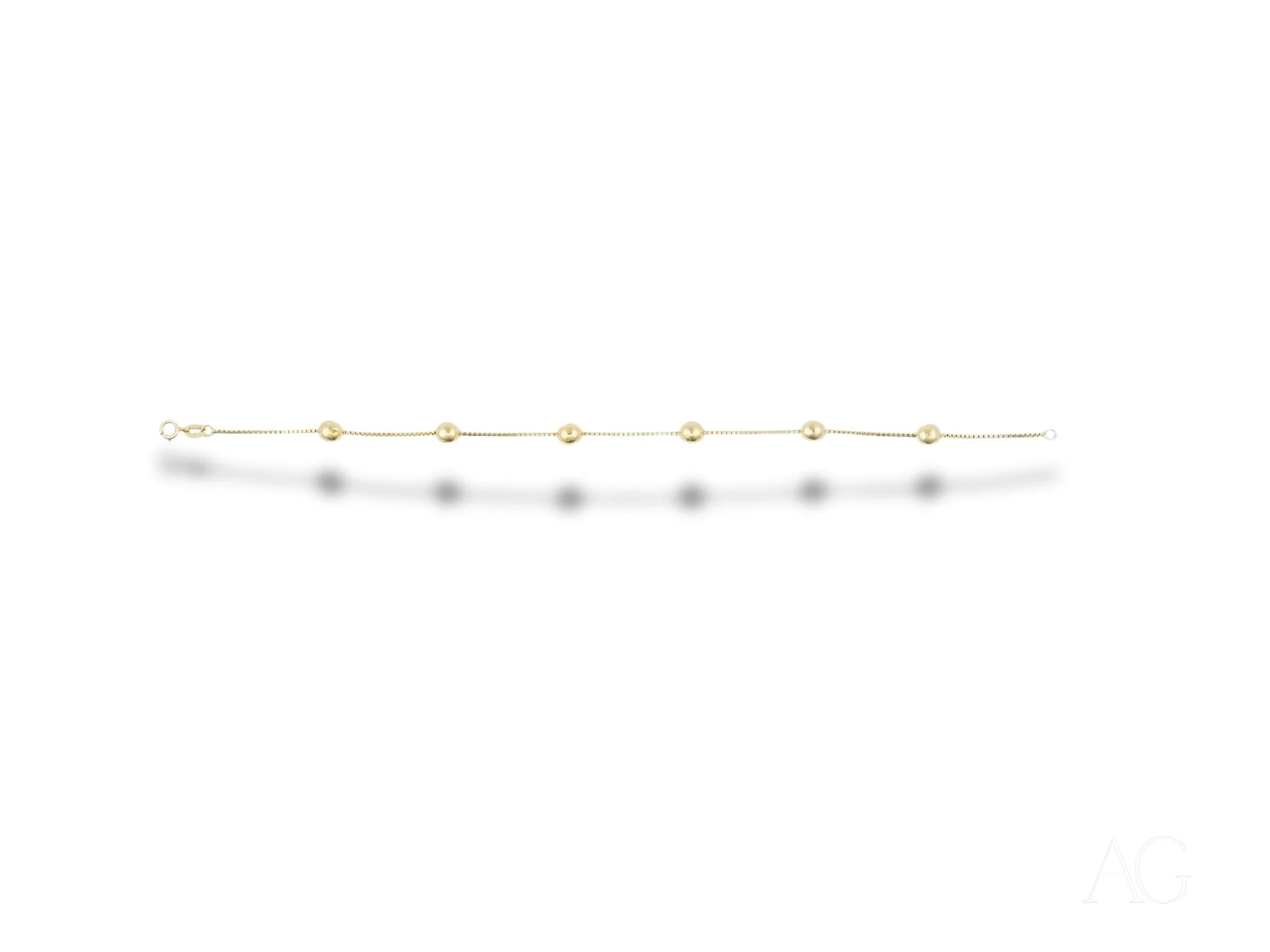 Delicate 18k gold bracelet with polished gold spheres