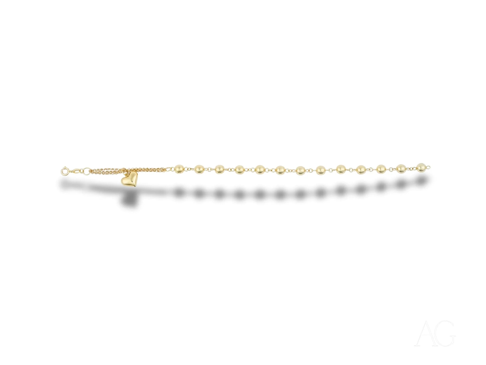 Elegant 18k gold bracelet with heart motif and polished gold beads