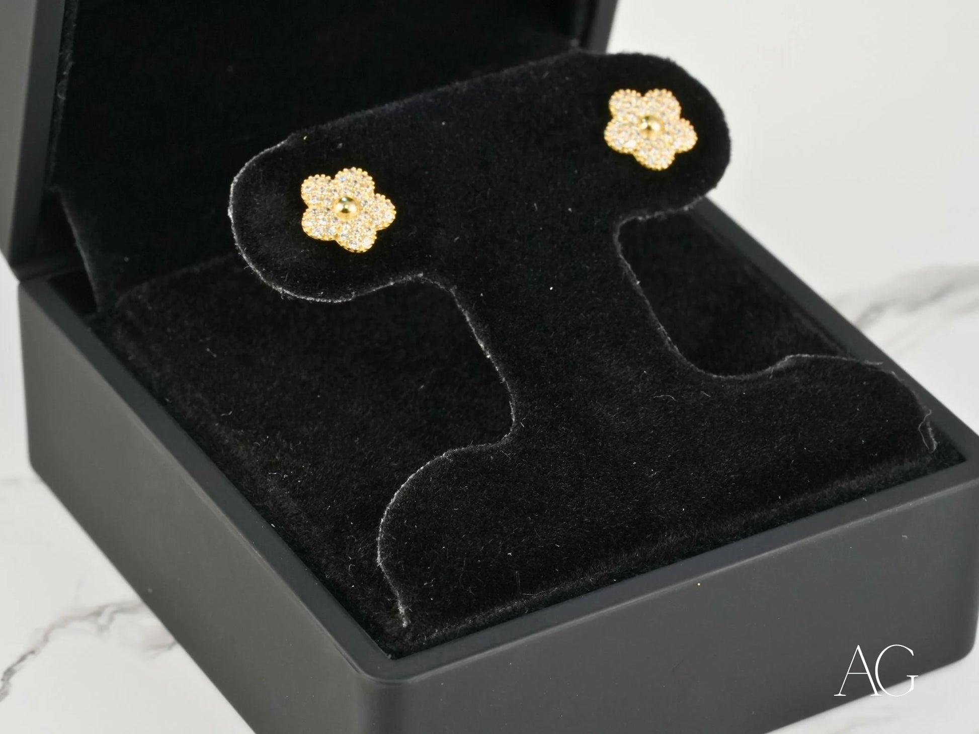 Flower-shaped gold CZ earrings in solid 18K gold, showcasing the Blossom Sparkle design