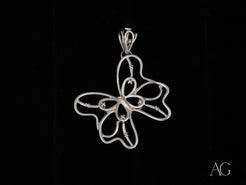 Silver wire butterfly pendant in delicate open-work design, crafted from 18k white gold