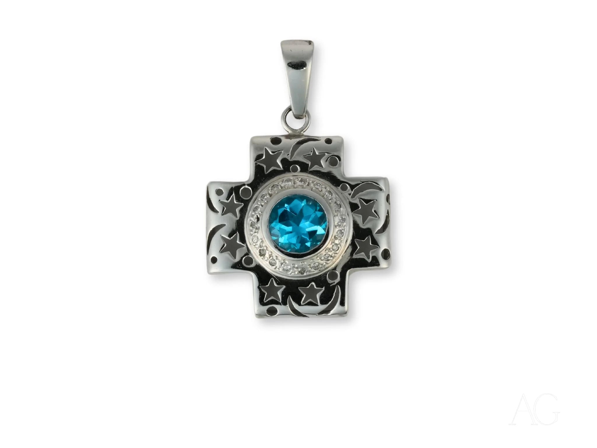 Silver cross pendant in 18k white gold with blue topaz gemstone centerpiece