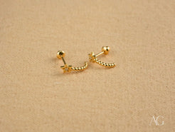 Gold Star Helix Earrings from Celestial Glow featuring a beaded crescent design
