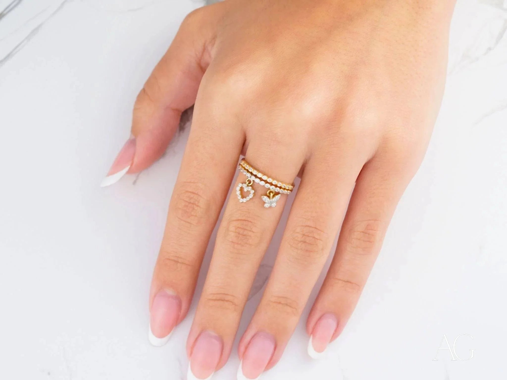 Gold ring showcasing delicate heart charms in 18k yellow gold for every occasion