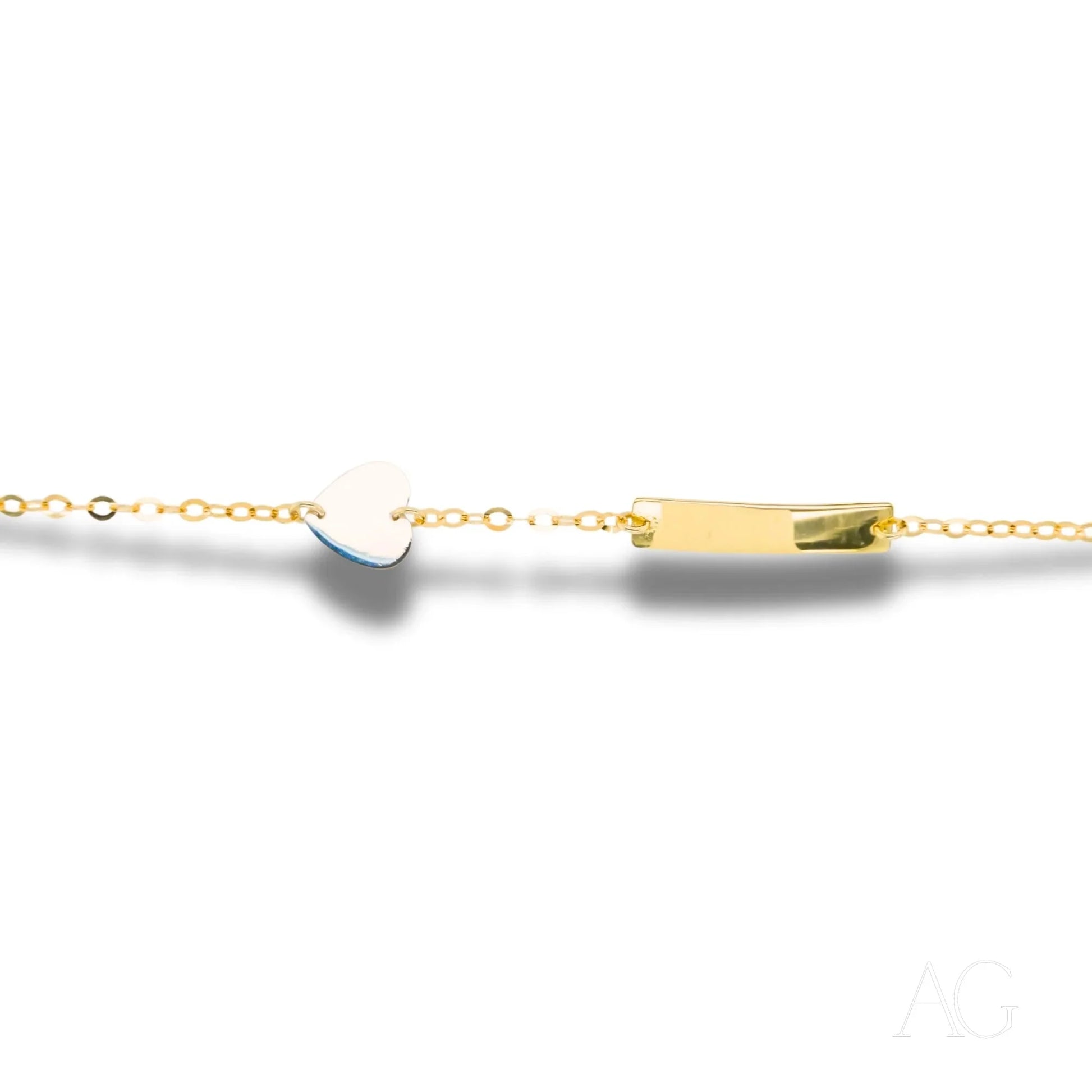 Delicate gold chain necklace with yellow gold heart motif and white gold pendant