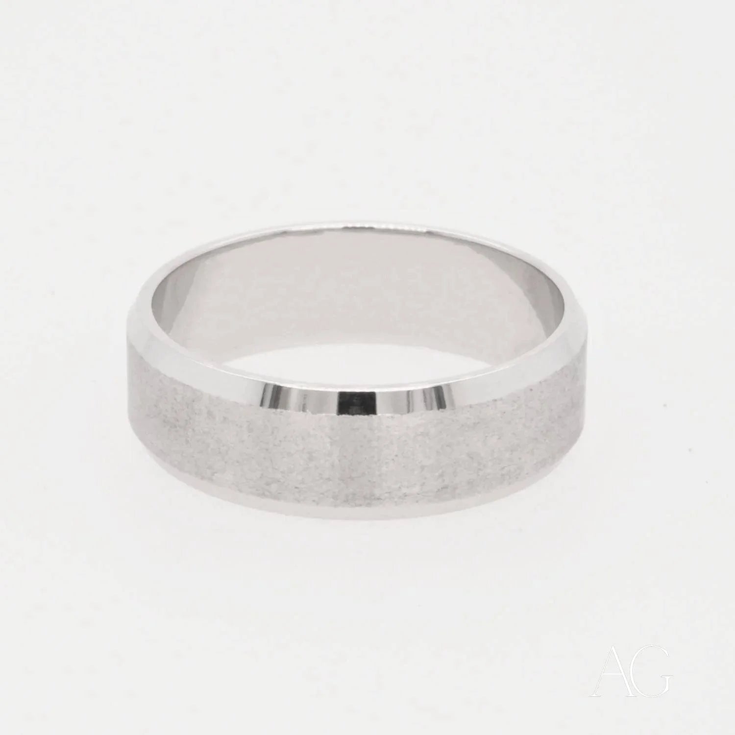 Silver wedding band in 18k white gold with brushed matte finish and polished edges