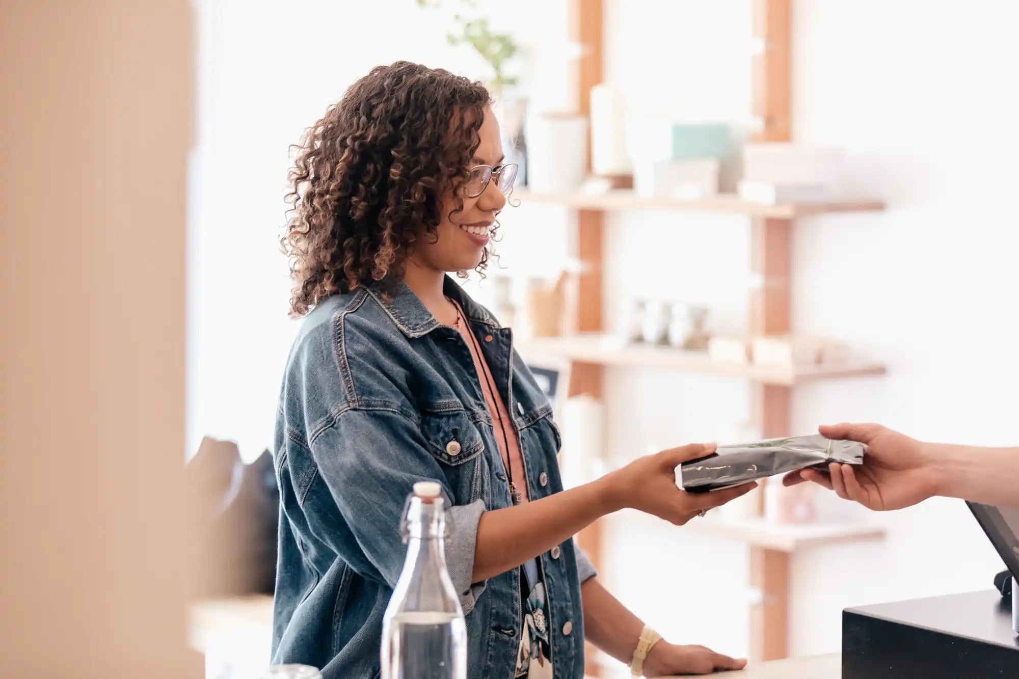 A customer making a payment transaction at a counter.