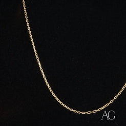 Delicate 18k gold chain necklace elegantly displayed against a dark background