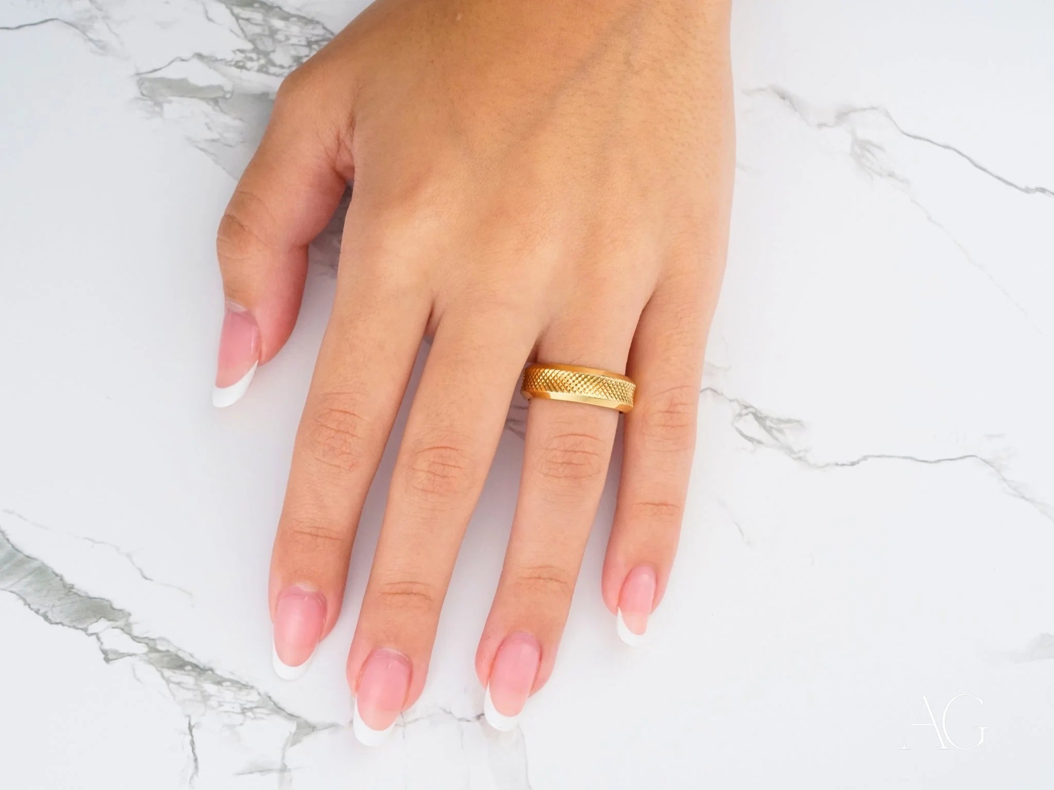 18k gold wedding band with twisted design for a classic fit on a finger