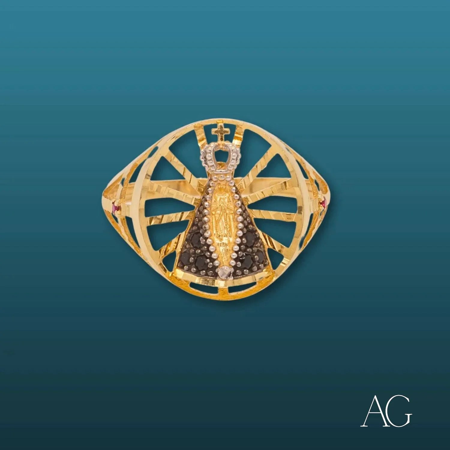 Ornate golden brooch shaped like a scarab, featured in Nossa Senhora ring design