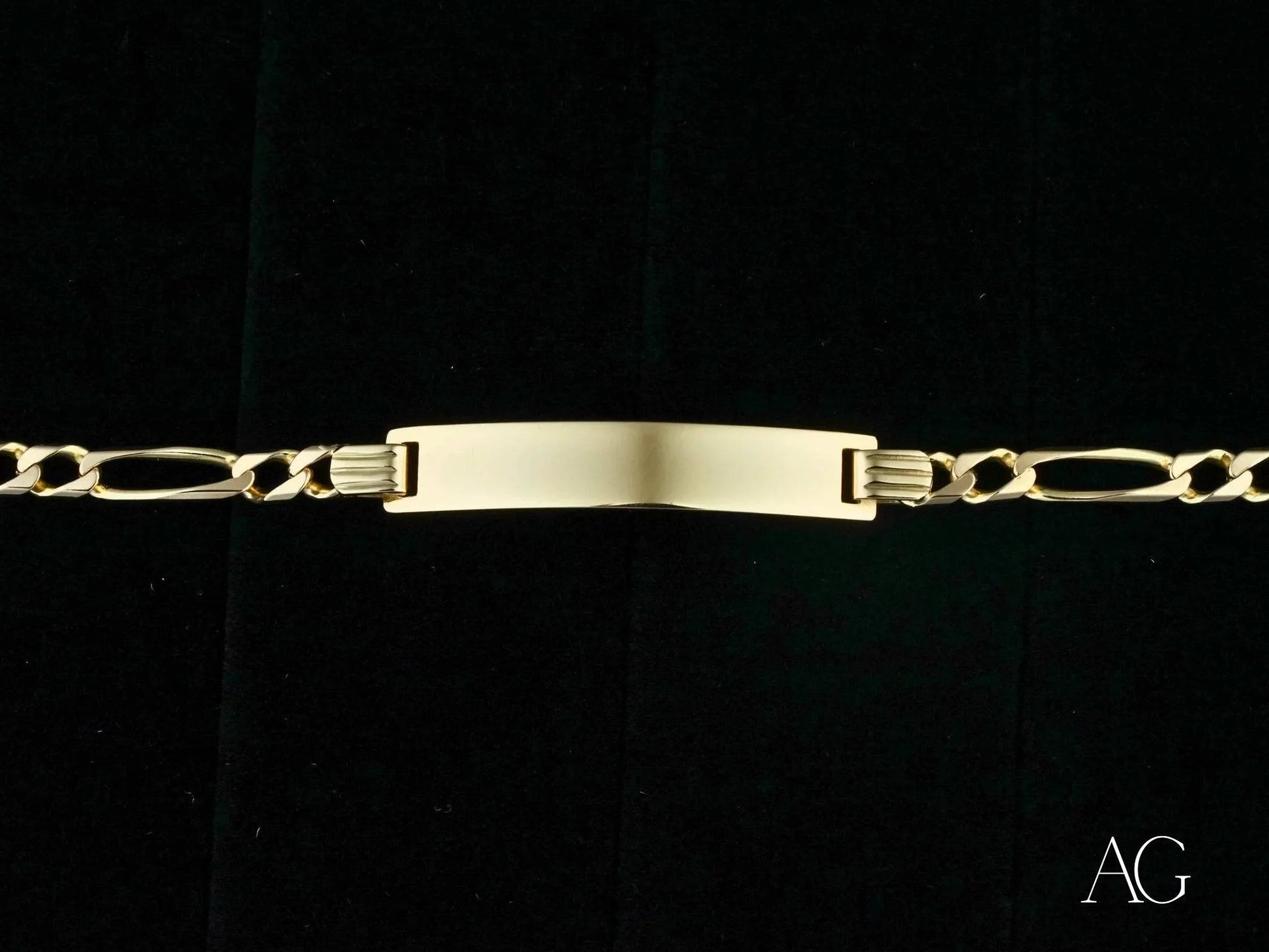 Gold-toned 18k solid gold identification bracelet with figaro chain links and nameplate