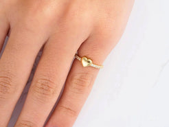 Gold ring with heart design, showcasing Elegance of Love in 18k yellow gold