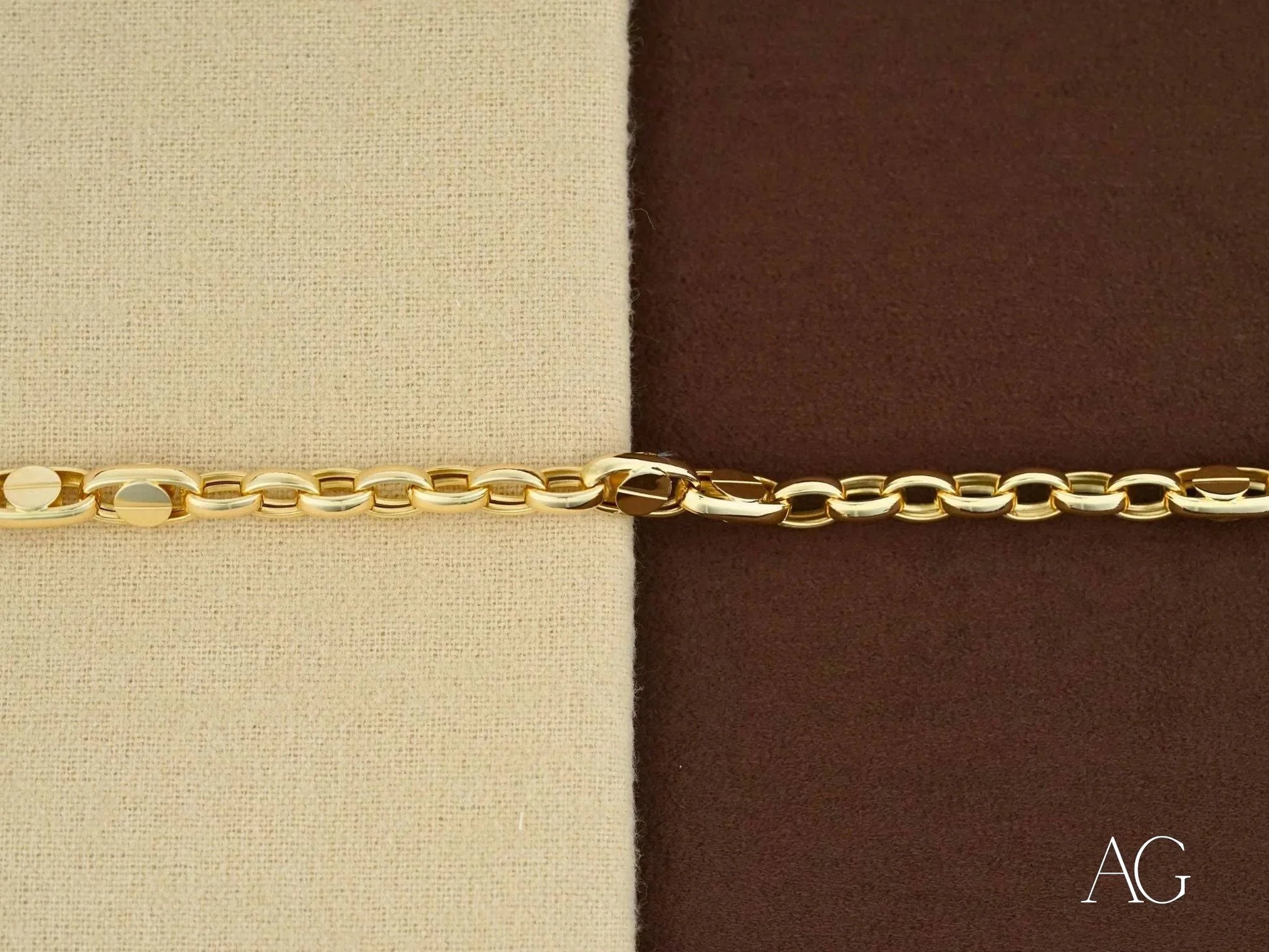 Elegant 18k solid gold men’s bracelet with lobster clasp on two-toned background