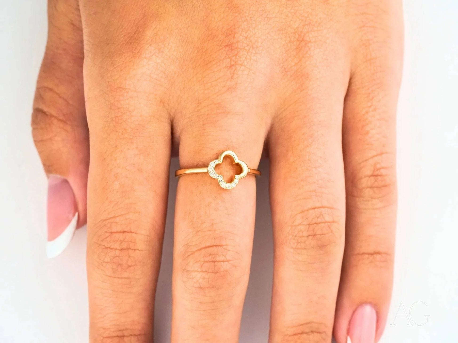 Gold ring featuring a clover design, part of the Elegant 18k Flower Diamond collection