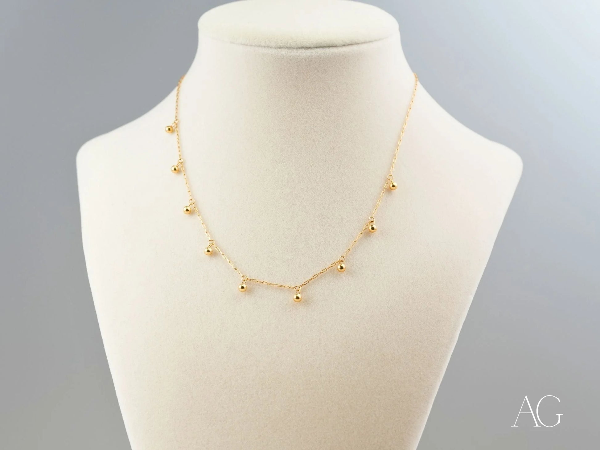 Elegant 18K Gold Beaded Necklace featuring dangling beads, perfect for art gold jewelry collection