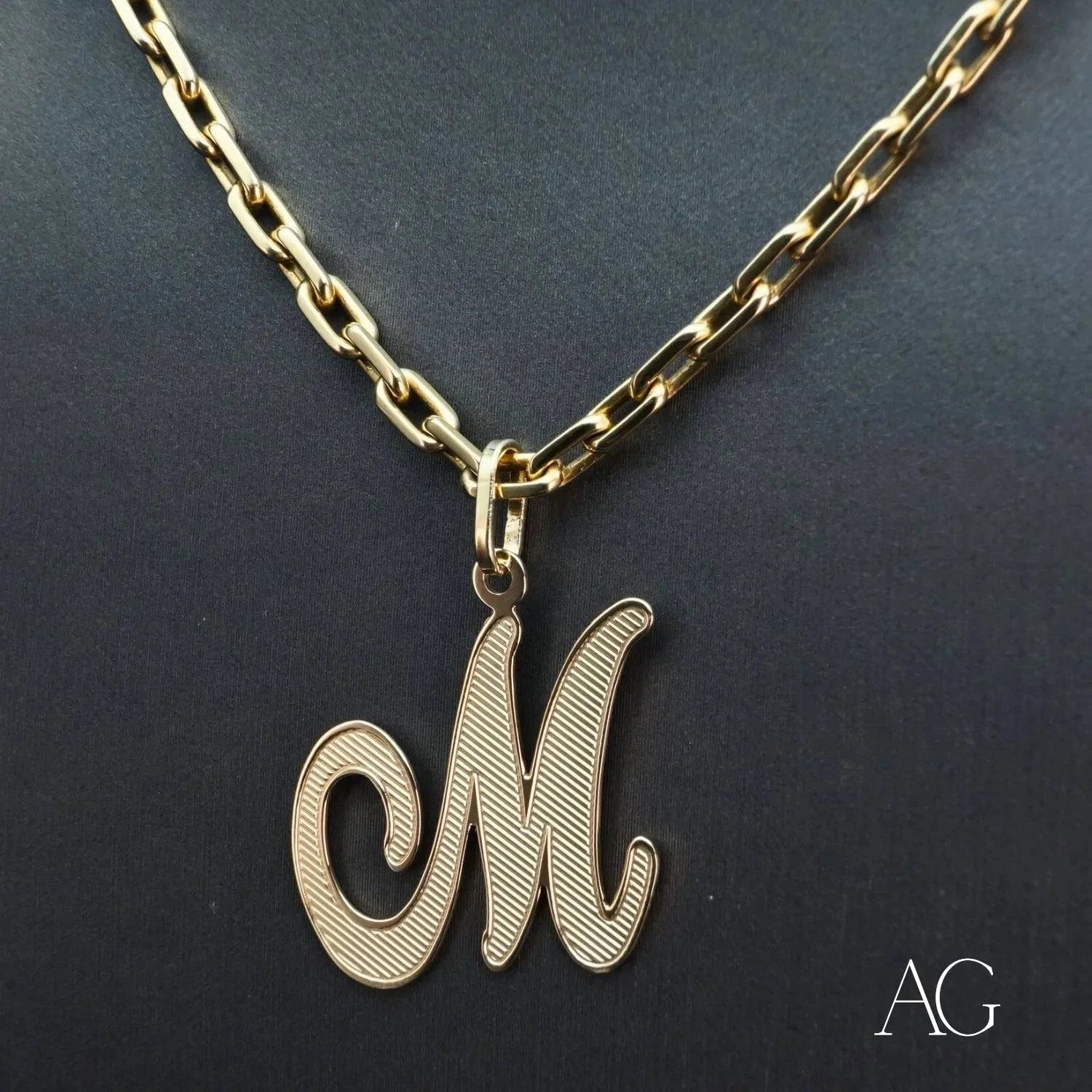 Elegant 18k Gold Letter M Pendant showcasing a cursive letter M design