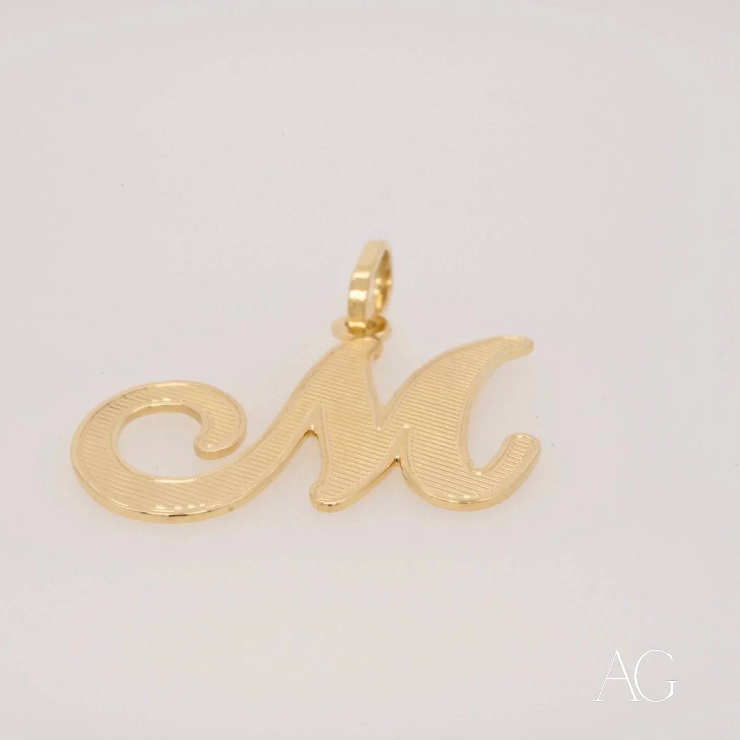 Elegant 18k Gold Letter M Pendant in cursive design for personalized jewelry styling