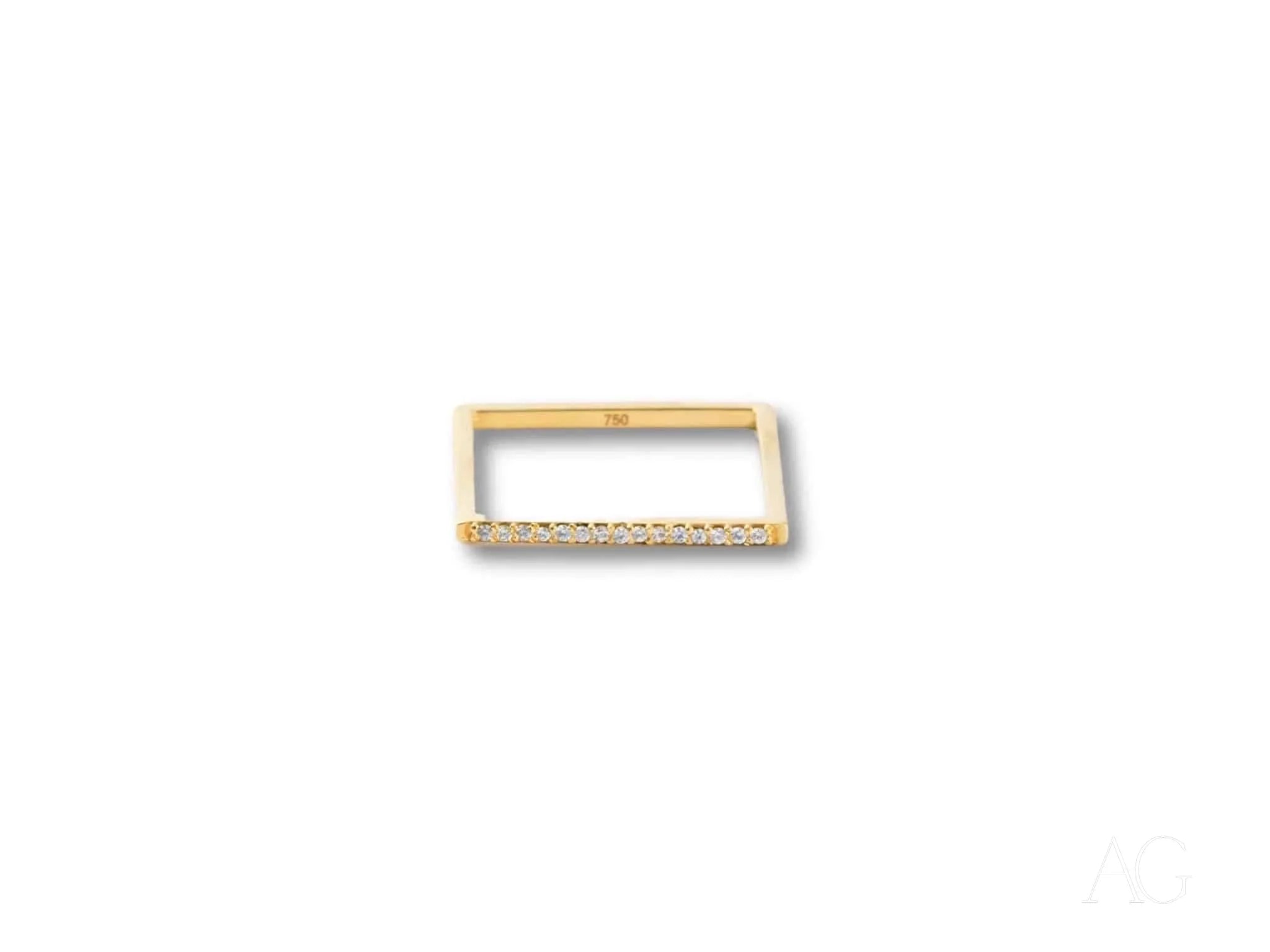 Rectangular gold-colored belt buckle with etching, highlighting 18k yellow gold design