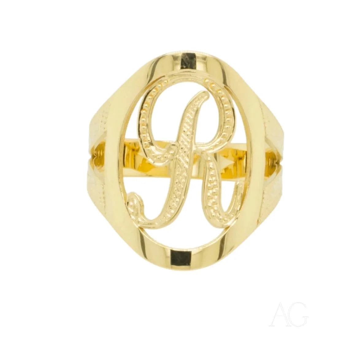 Gold-colored initial letter ring with a cursive R centerpiece, art gold design