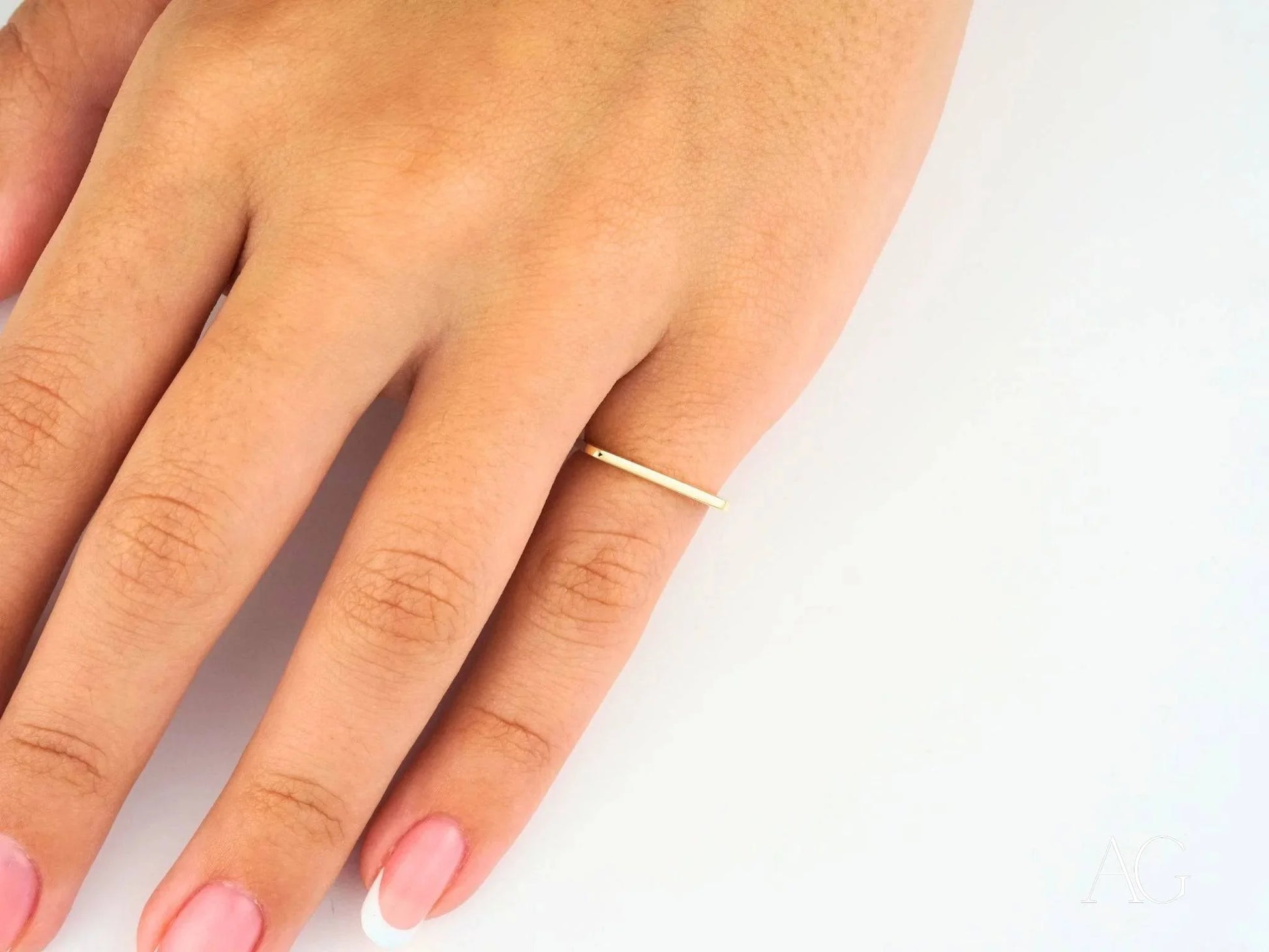 Thin 18k yellow gold band ring for minimalist luxury on any occasion