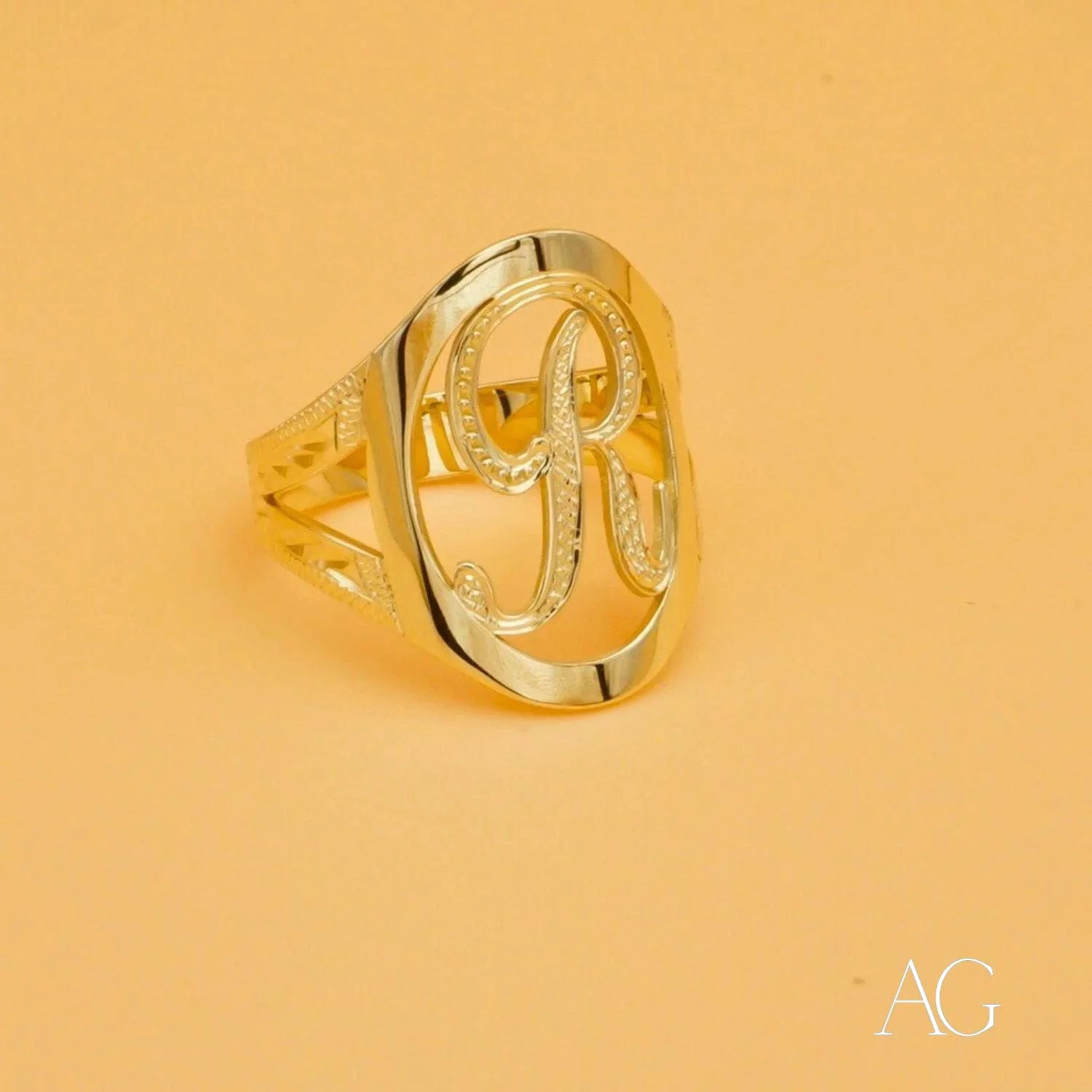 Gold-colored art gold Initial Letter Ring with ornate cursive letter R design