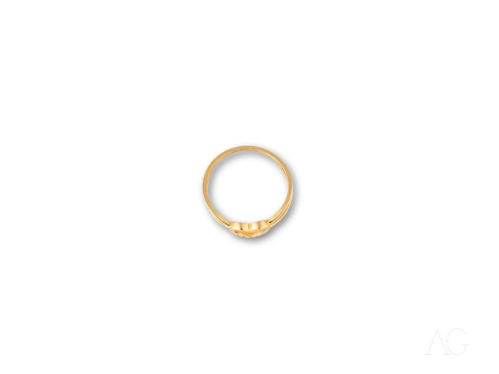 Elegant 18k yellow gold heart ring featuring three small diamonds in the band