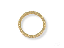 Gold eternity ring with notched design, showcasing elegant 18k gold craftsmanship