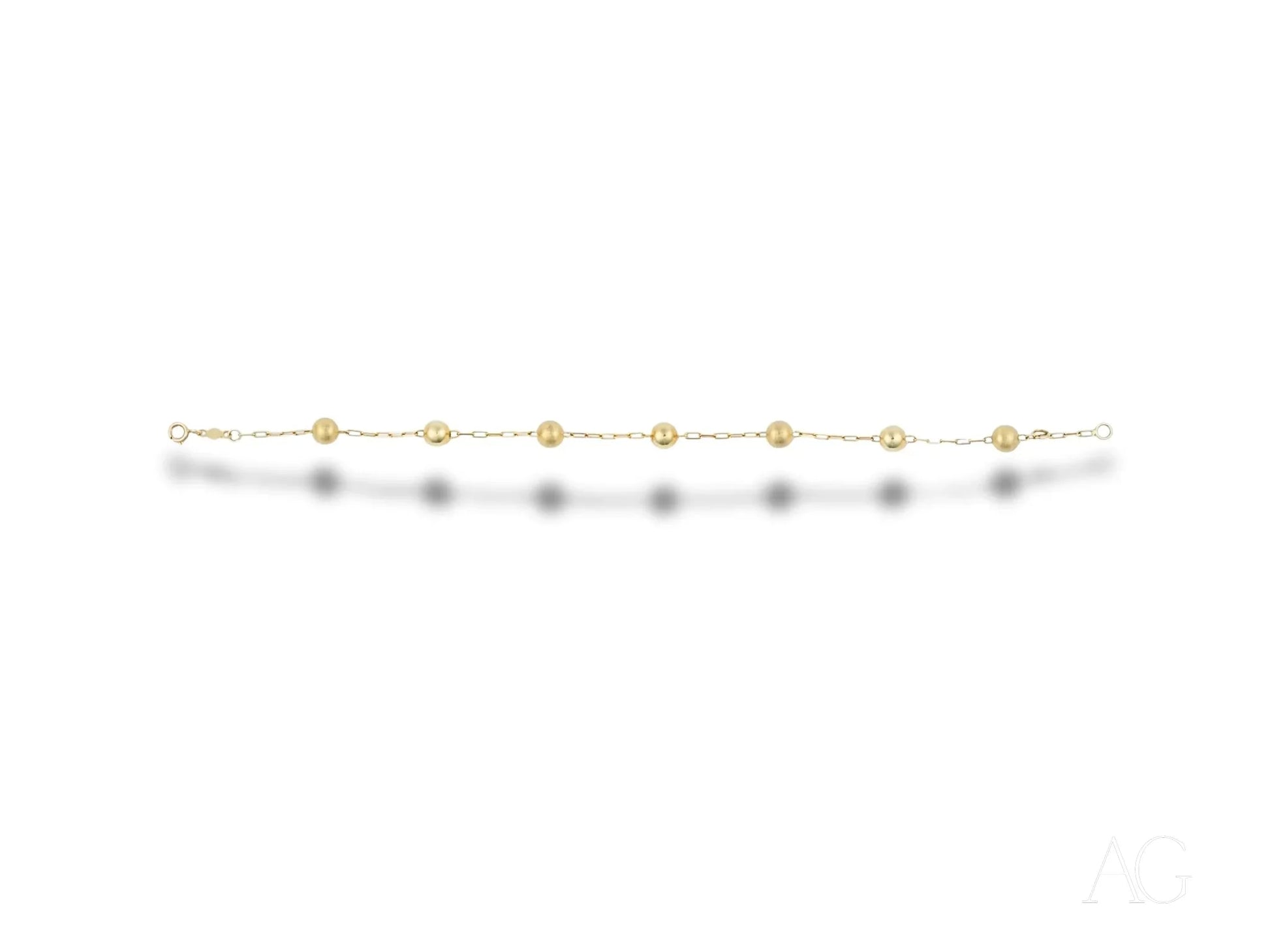 Elegant women’s 18k gold bracelet with spring ring clasp and delicate round beads