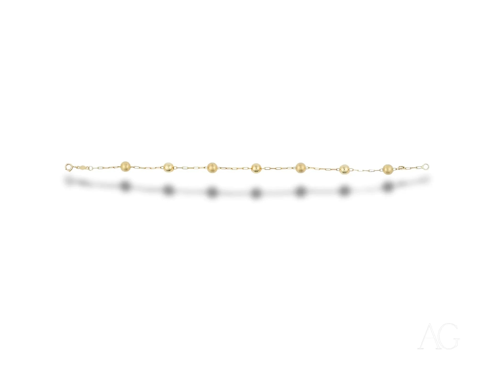 Elegant women’s 18k gold bracelet with spring ring clasp and delicate round beads