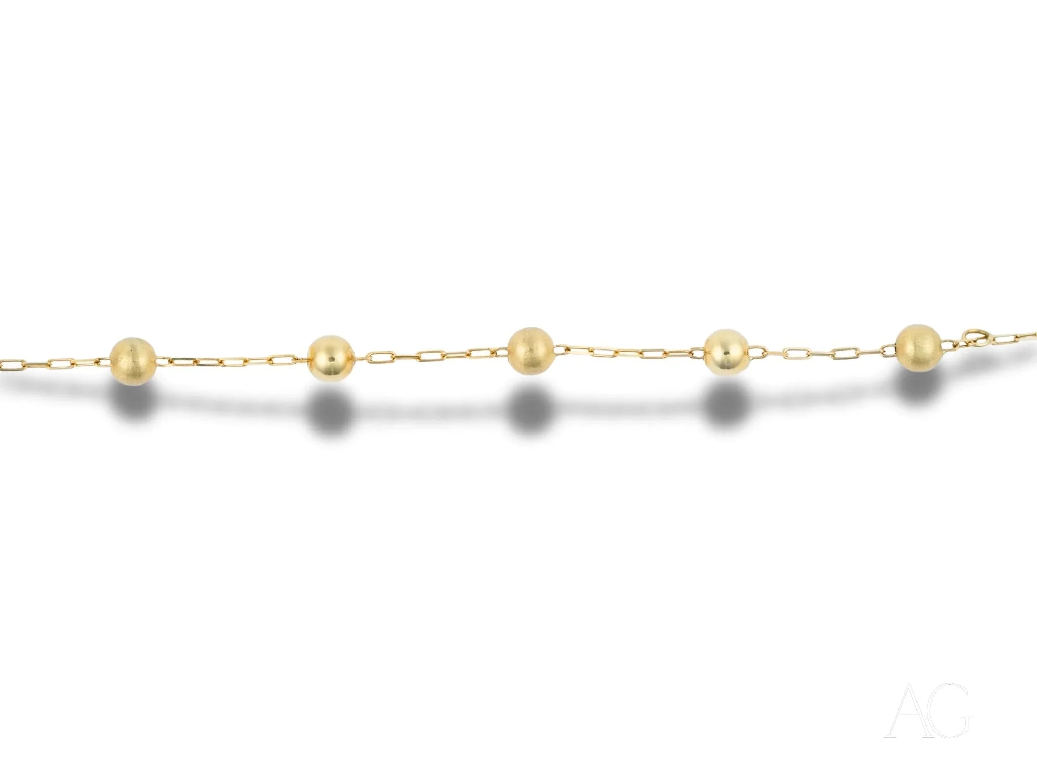 Elegant 18k gold bracelet with spring ring clasp and pearl-like beads design