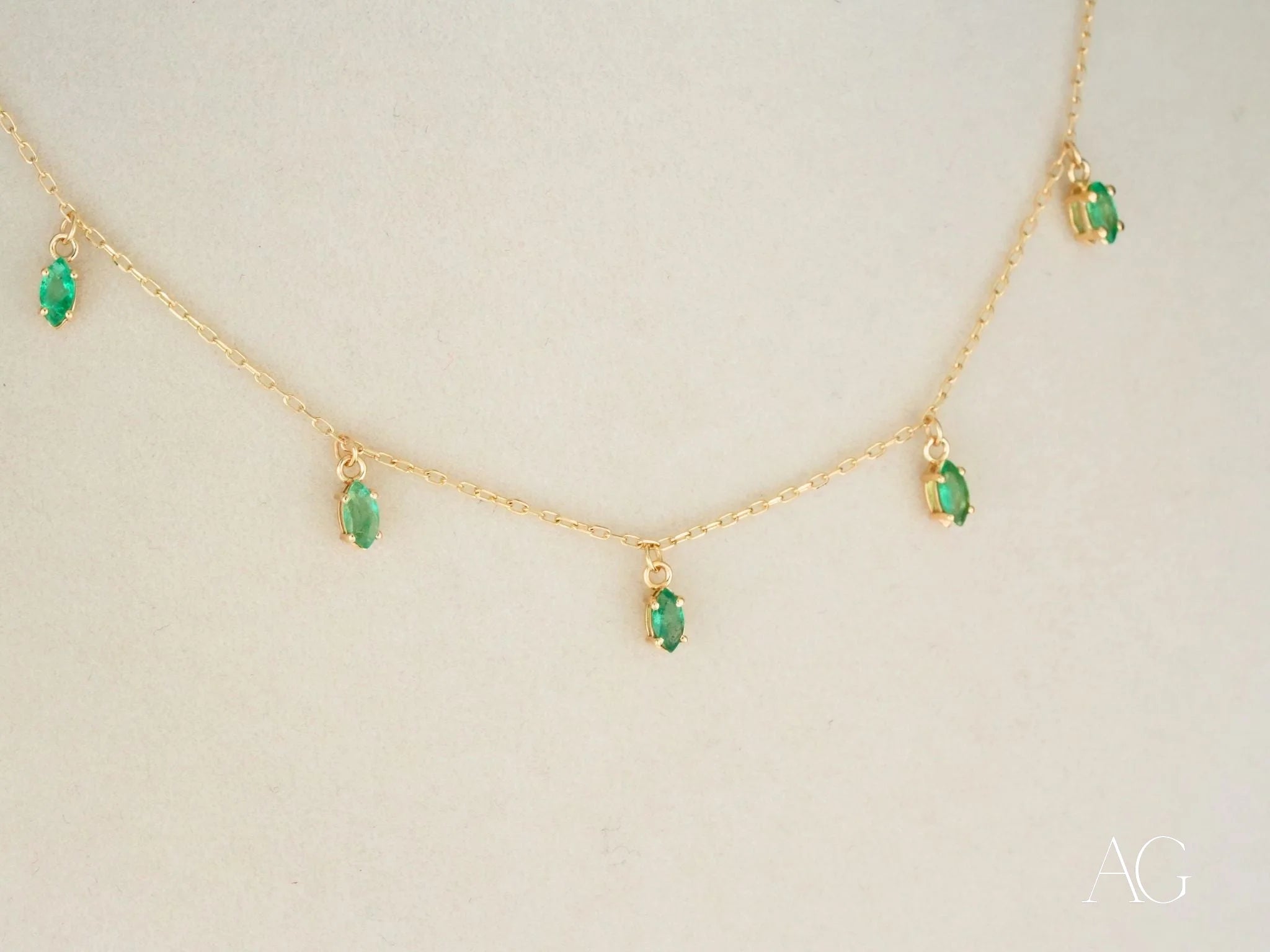 Elegant 18k Gold Emerald Necklace showcasing stunning marquise-cut emerald droplets