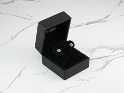 Square Emerald Stud Earrings in a Black Jewelry Box showcasing Green Cubic Zirconia Halo Design