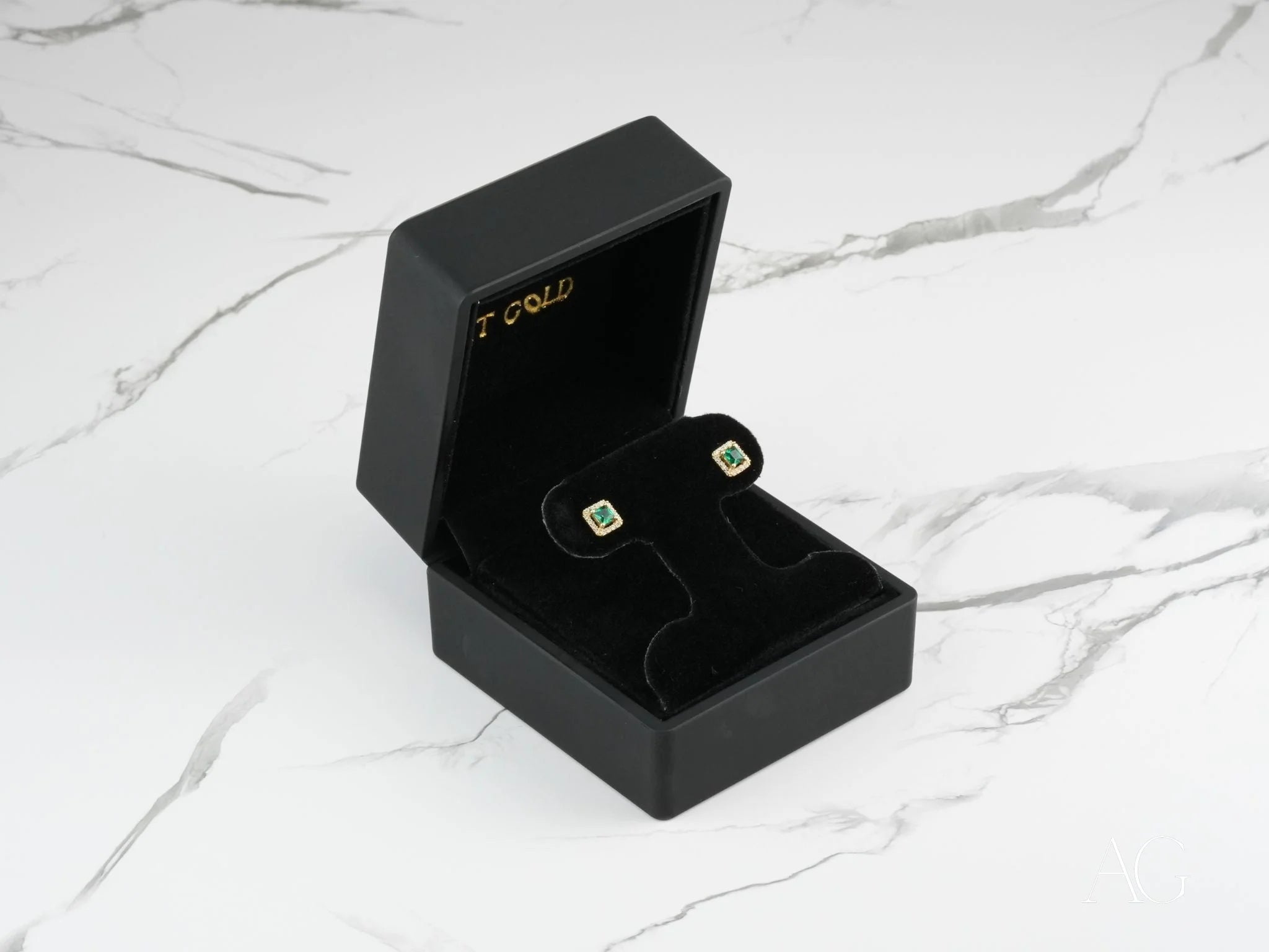 Square Emerald Stud Earrings in a Black Jewelry Box showcasing Green Cubic Zirconia Halo Design