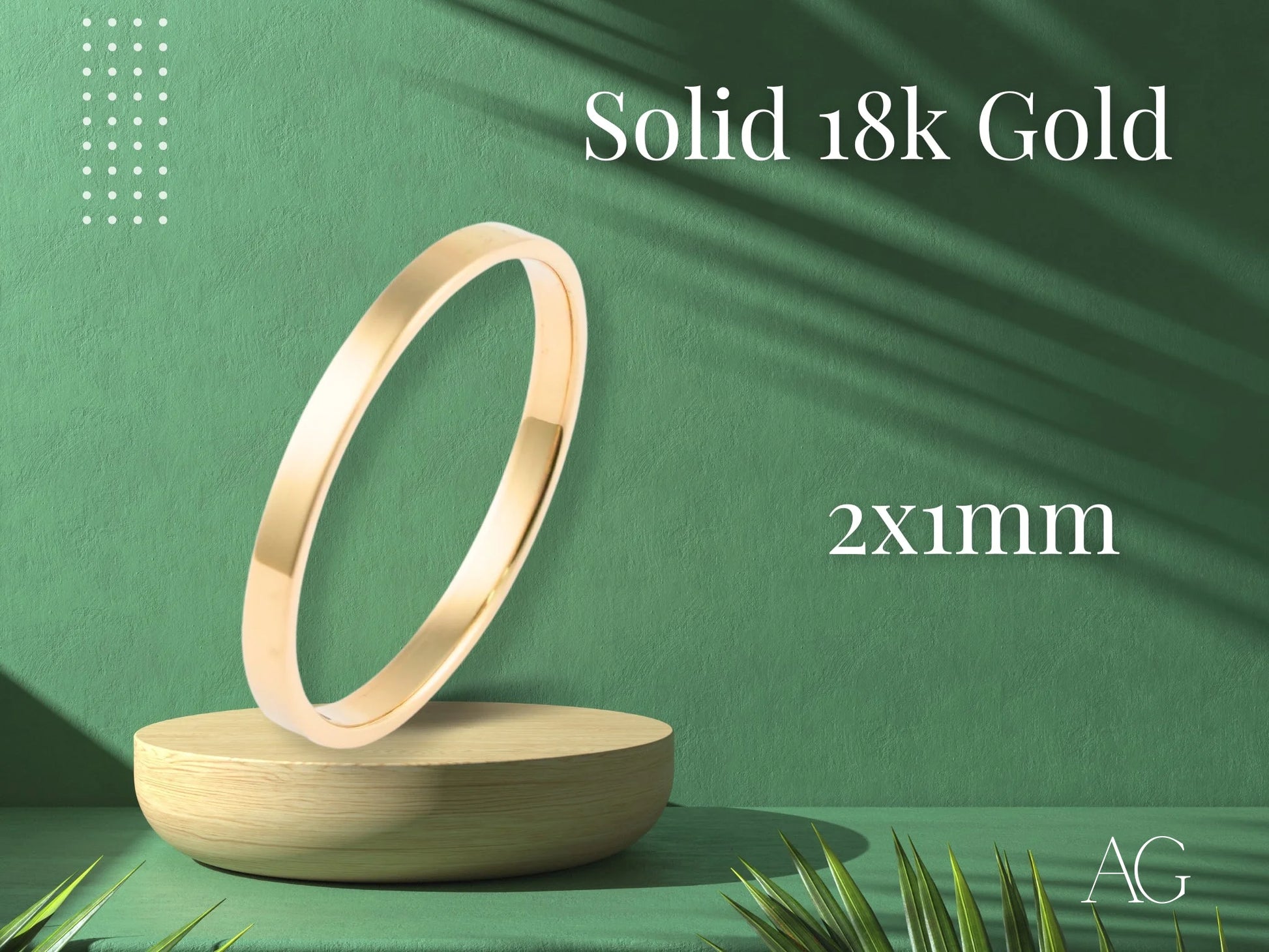 Gold bangle displayed on a stand with a focus on timeless minimalist elegance and design