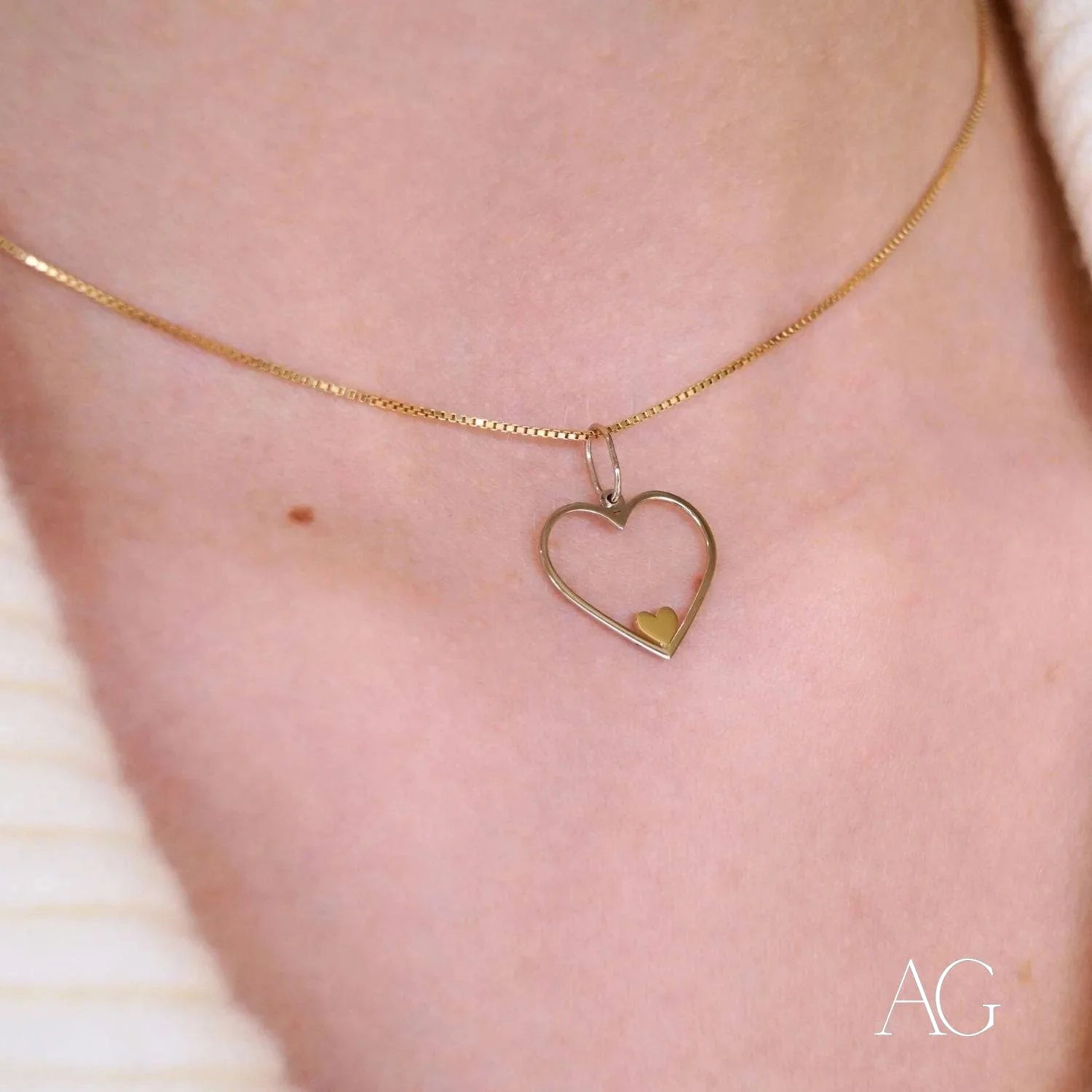 Heartfelt glint pendant featuring a heart-shaped design on a delicate 14k gold chain