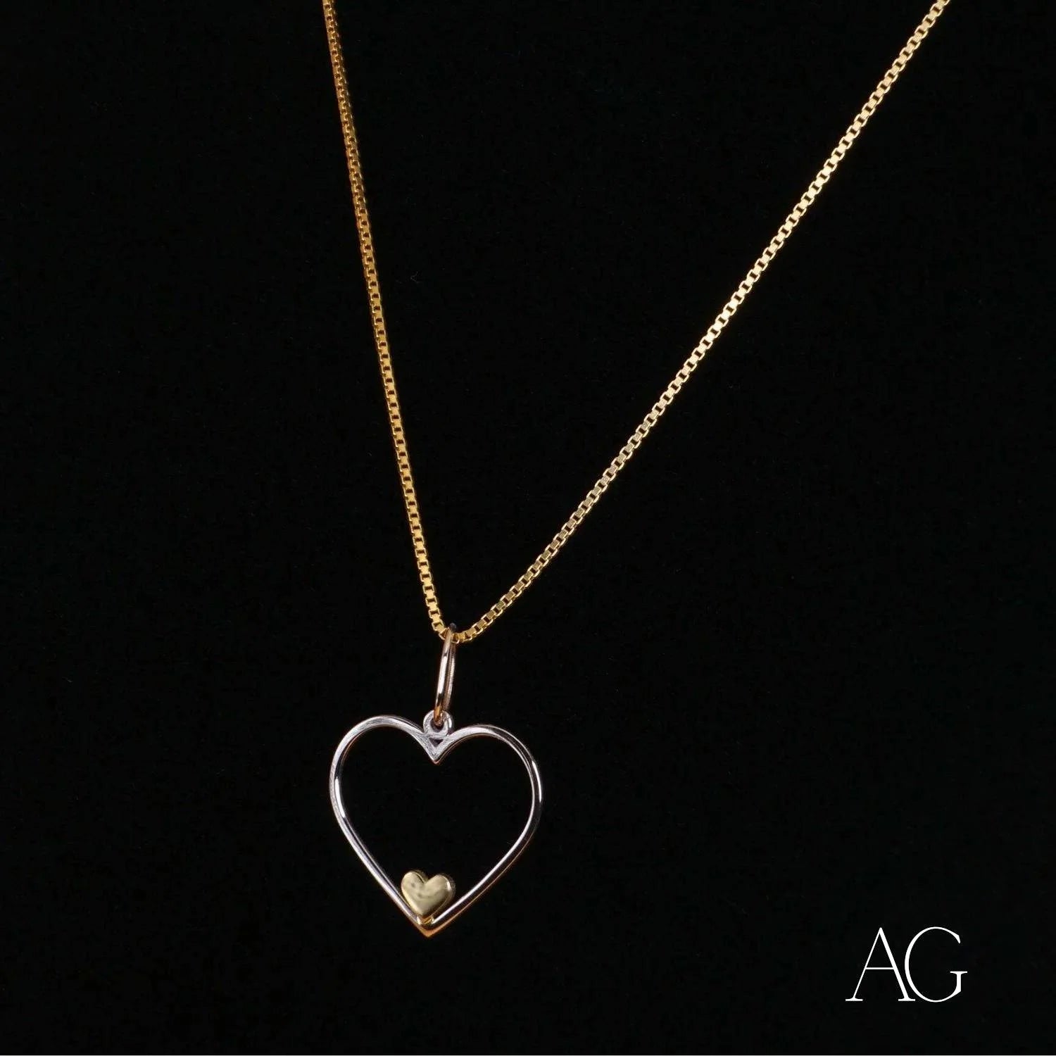 Heartfelt glint pendant featuring a heart-shaped 14k gold necklace with a gold bead