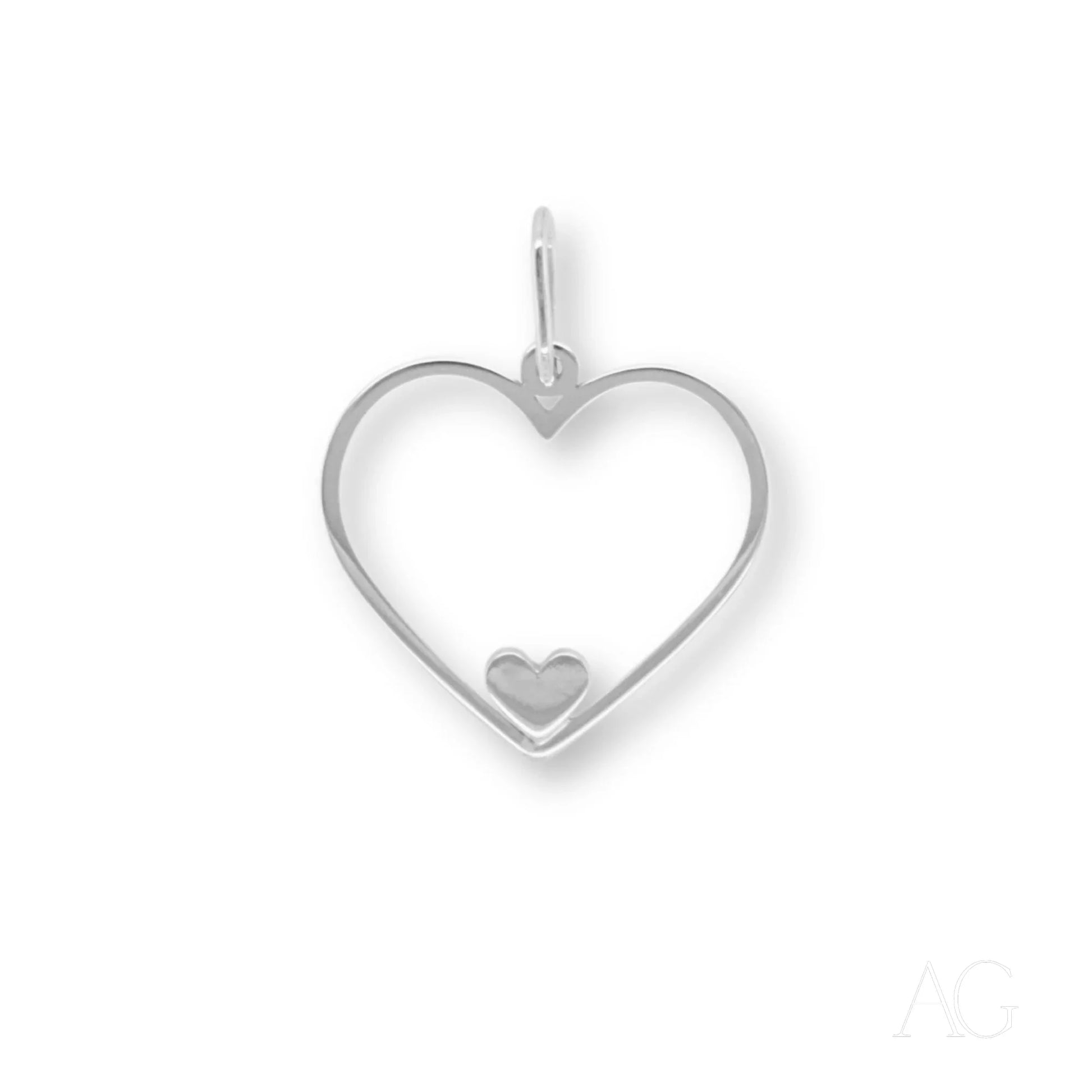 Heart-shaped 14k gold Eternal Love Pendant with a smaller heart inside showcasing heartfelt glint