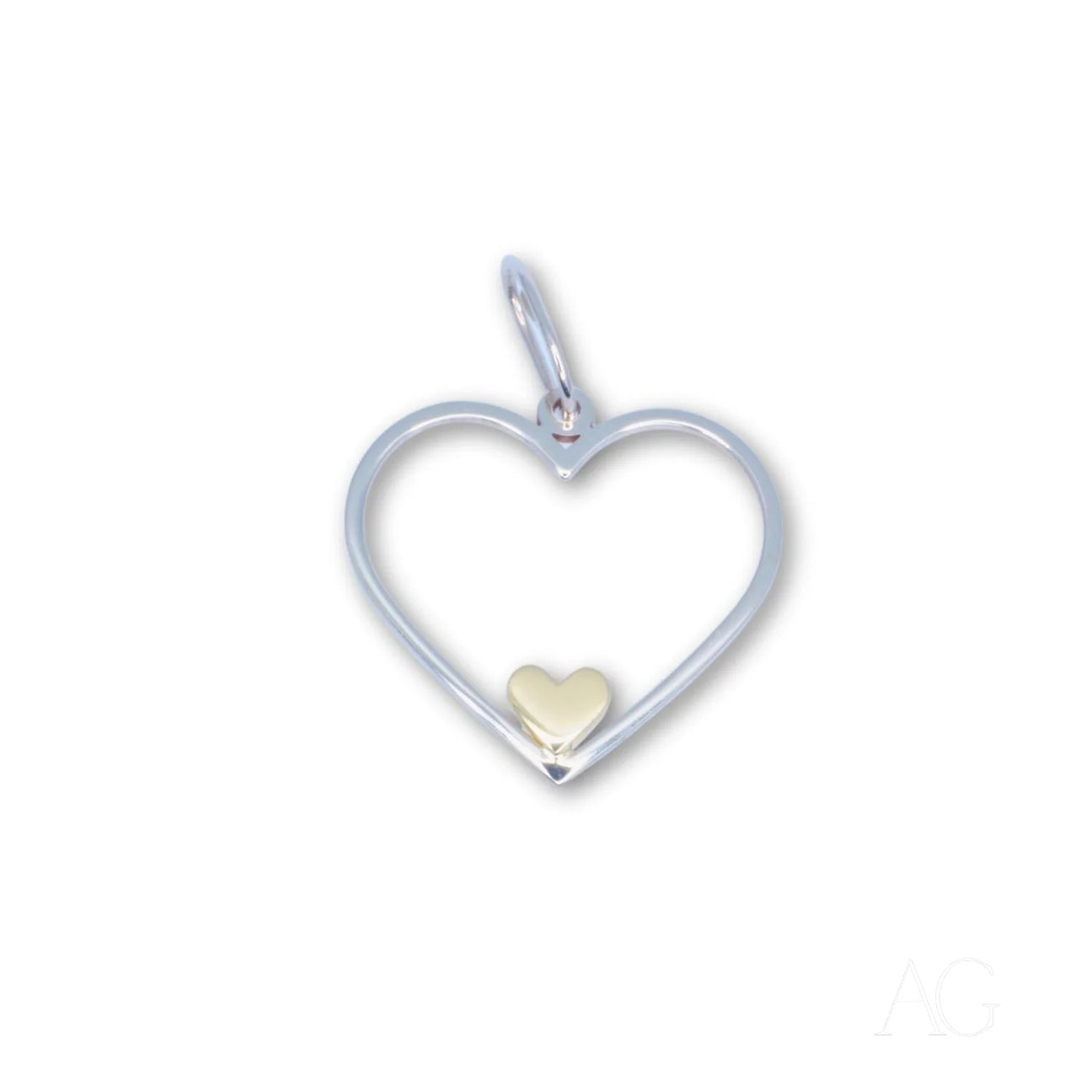 Heartfelt glint pendant featuring a heart-shaped sterling silver design with a gold heart