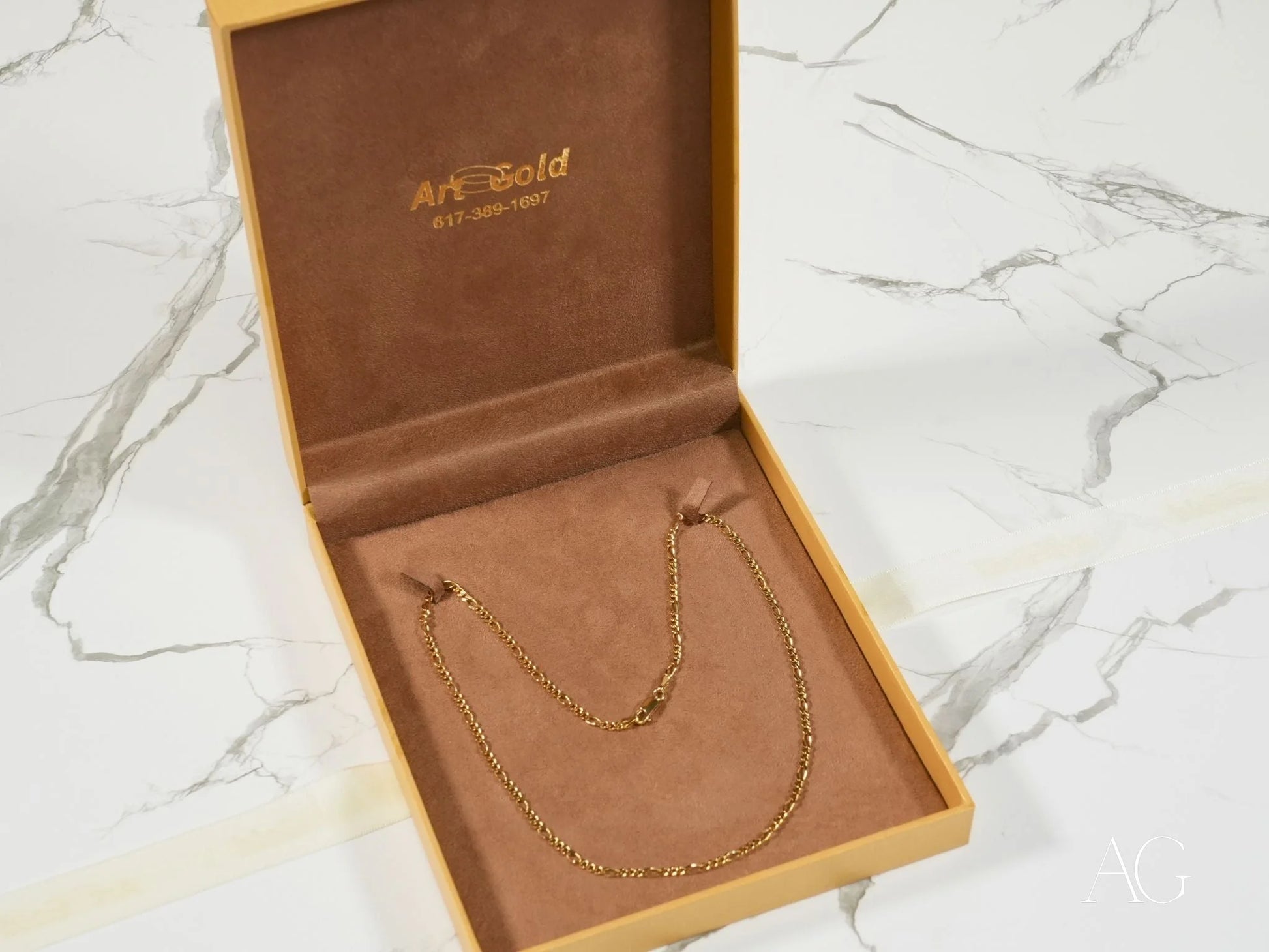 Gold Figaro Chain in presentation box showcasing Eternal Prestige 18K Gold craftsmanship