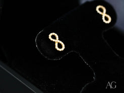 Eternal Spark 18K Gold Infinity CZ Earrings featuring a stylish infinity symbol design