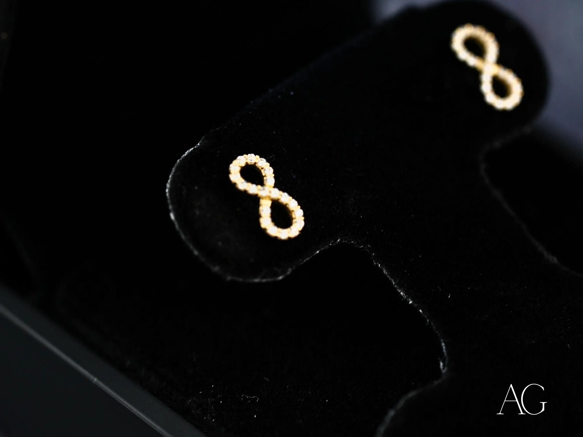 Eternal Spark 18K Gold Infinity CZ Earrings featuring a stylish infinity symbol design